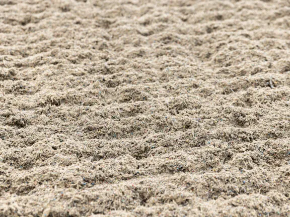 Close up of sand and fibre gallop surface
