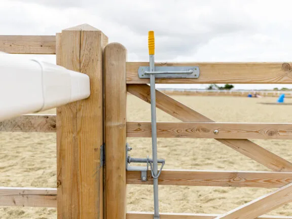 An equestrian gate latch mechanism