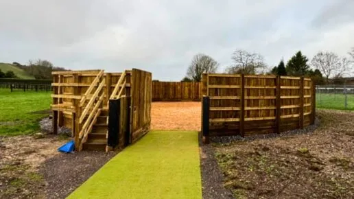A fully boarded lunge ring with viewing platform